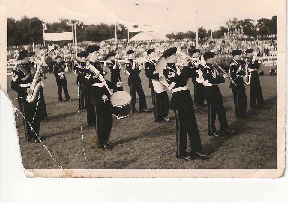 Front row. Front to back. DEREK BROADBENT (cornet) BILL HOUSLEY (Clt) KEN JACKSON (alto) N/K 2nd Row. ROY MELIA (snare drum) N/K N/K 3rd row. WILF HARRISON (tenor) K/N ROGER RATCLIFFE (clarinet)