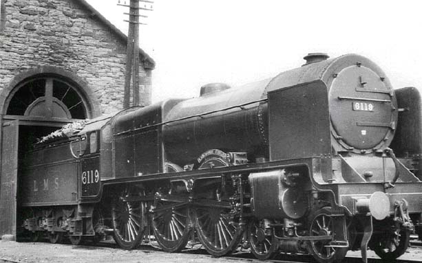 6119 LANCASHIRE FUSILIER IN JULY 1933 shows off its new smoke deflectors, (fitted in Jan 1932) as it pokes out its nose from the shed at Perth.